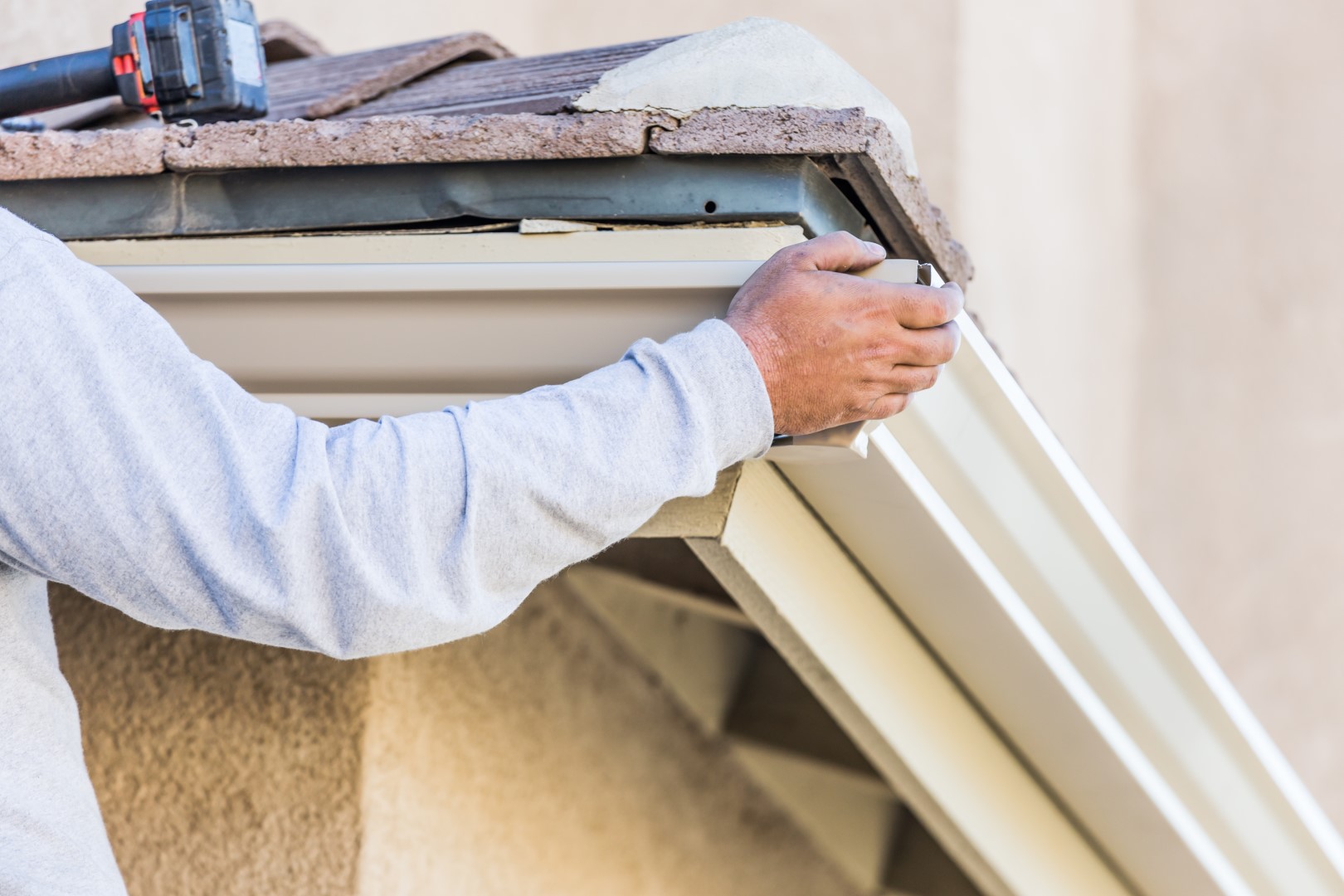 man-repairing-gutter-with-power-tool-outside-home-2026-09-22-13-37-15-utc (Large) man-repairing-gutter-with-power-tool-outside-home-2026-09-22-13-37-15-utc (Large)
