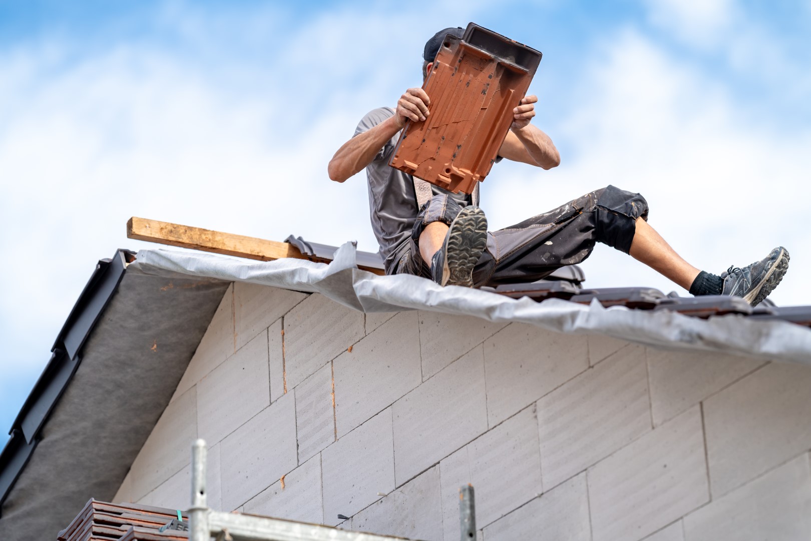 roofer-on-roof-repairing-tiles-with-blue-sky-2026-09-23-06-41-07-utc (Large) roofer-on-roof-repairing-tiles-with-blue-sky-2026-09-23-06-41-07-utc (Large)